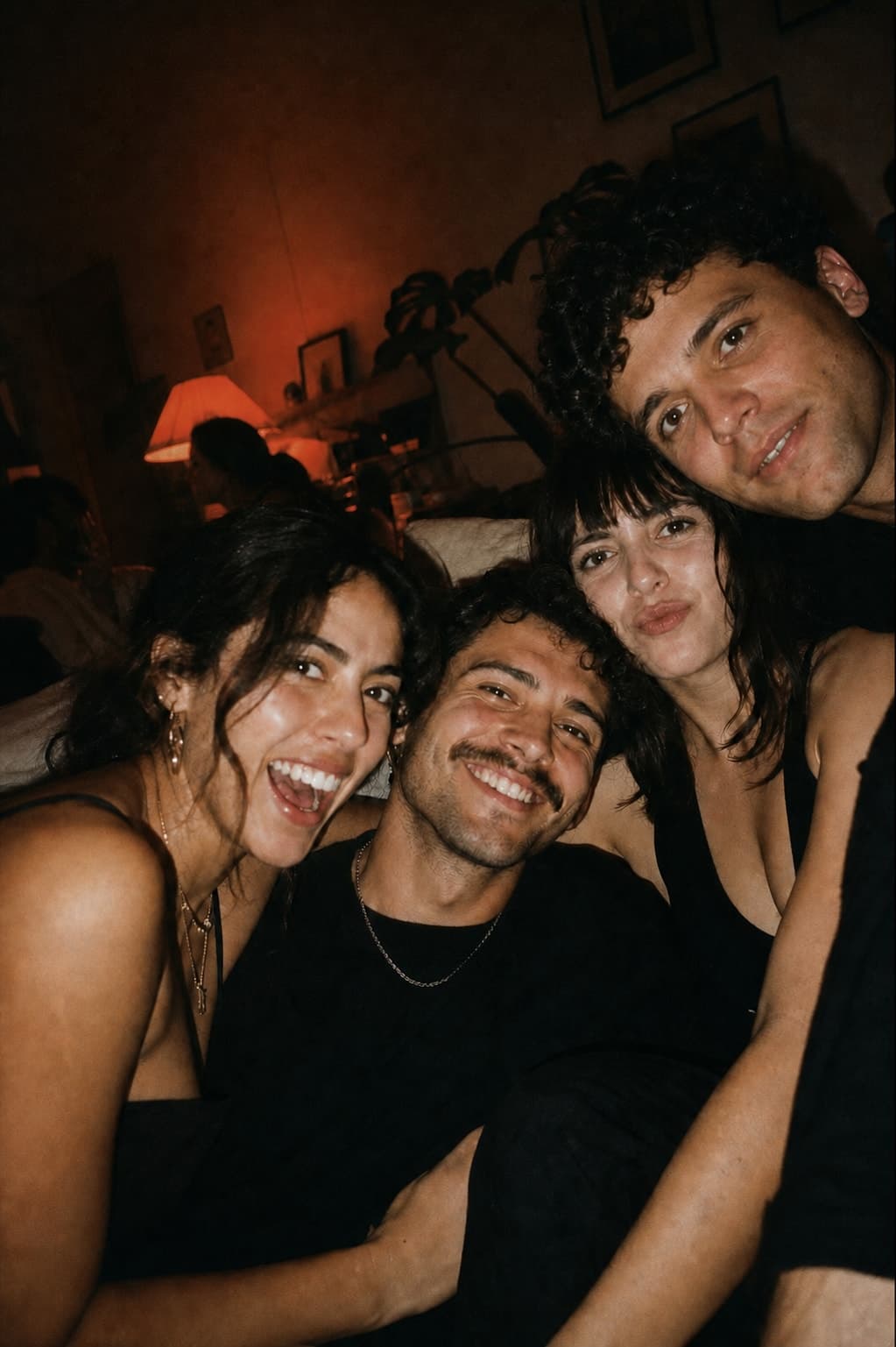 Friends squeezed together on a couch